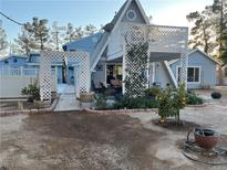 Charming single-Gathering home with unique lattice archway and landscaped front yard at 6171 Whispering Sands Dr, Las Vegas, NV 89131