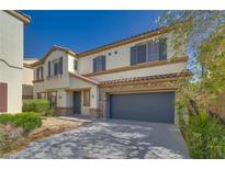 Charming two-story home with a two-car garage, desert landscaping, and stone accents at 8348 Mokena Ave, Las Vegas, NV 89178
