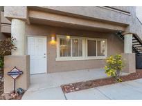 Charming condo exterior with a cozy entryway and well-maintained landscaping at 2152 Turquoise Ridge St # 105, Las Vegas, NV 89117
