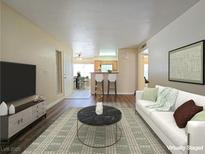 Bright living room with modern decor, open floor plan, and stylish furnishings, creating an inviting and comfortable space at 3038 Tarpon Dr # 103, Las Vegas, NV 89120