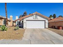 Charming single-story home featuring a well-maintained front yard and a two-car garage at 4130 Lucas Ave, Las Vegas, NV 89120