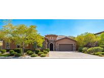 Charming single-story home with desert landscaping, stone accents, and a paver driveway at 47 Grand Masters Dr, Las Vegas, NV 89141