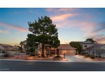 Charming single-story home with mature landscaping, a well-manicured yard, and a spacious driveway at 5528 Apache Wells Way, Las Vegas, NV 89130