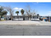 Charming single story home with a low maintenance yard and plenty of curb appeal in a quiet neighborhood at 909 Hazard Ave, Las Vegas, NV 89108