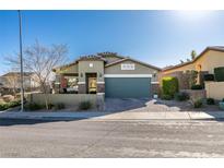 Charming one-story home featuring a well-manicured front yard and inviting curb appeal at 124 Strone St, Henderson, NV 89012
