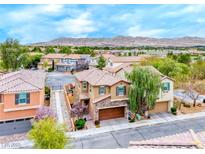 Charming two-story home with stone accents, desert landscaping, and beautiful mountain views at 3767 Westeros Landing Ave, Las Vegas, NV 89141