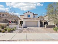 Charming two-story home featuring a desert-landscaped yard, brick driveway, and attached two-car garage at 457 Cornelius Kelly Ave, Henderson, NV 89011