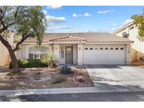 Charming single-story home with a well-manicured front yard and two-car garage at 9581 Ancala Hollow Ct, Las Vegas, NV 89148