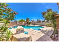 Stunning backyard oasis features a sparkling pool, spa, and mature landscaping perfect for outdoor entertaining at 361 Tobler Dr, Las Vegas, NV 89145