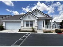 Charming single-story home featuring a two-car garage, white picket fence and landscaped front yard at 5263 Shasta Lake Way, Las Vegas, NV 89118