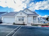 Charming single-story home with well-maintained landscaping, white picket fence, and attached one-car garage at 5263 Shasta Lake Way, Las Vegas, NV 89118
