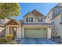 Charming two-story home featuring a two-car garage, inviting curb appeal, and well-maintained landscaping at 5916 Sierra Cliff St, North Las Vegas, NV 89031