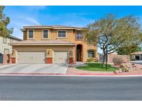 Charming two-story home featuring a well-manicured lawn, three-car garage and a classic color palette at 8102 Villa De La Playa St, Las Vegas, NV 89131