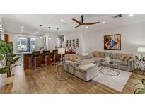 An open floor plan showcases a living room and kitchen with stainless steel appliances at 9050 W Tropicana Ave # 1102, Las Vegas, NV 89147