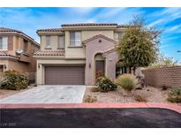 Charming two-story home features a well-maintained yard, attached garage, and inviting facade at 11820 Calle De Sol Dr, Las Vegas, NV 89138