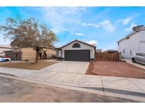 Charming single-story home with a two-car garage and low-maintenance landscaping at 2120 Maple Springs St, Henderson, NV 89002