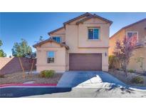 Charming two-story home features a well-maintained front yard and a two-car garage at 4908 Desert Lime Ct, Las Vegas, NV 89148