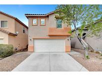 Charming two-story home with a two-car garage and well-maintained landscaping at 5044 Whistling Acres Ave, Las Vegas, NV 89131
