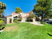 Charming single-Gathering home with lush front lawn, mature trees and a private gated courtyard at 5381 Waving Sage Dr, Las Vegas, NV 89149