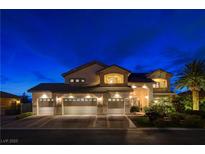 Stunning two-story home featuring a three-car garage, meticulous landscaping, and a grand entrance at 9475 Windham Heights Ct, Las Vegas, NV 89139