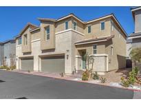 Modern two-story home featuring a two car garage, neutral color palette, and tidy landscaping at 2682 Weathered Copper Ave, North Las Vegas, NV 89086