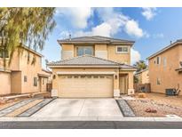 Charming two-story home featuring a spacious two-car garage and a well-maintained front yard with desert landscaping at 3916 Otter Corner Ct, Las Vegas, NV 89122
