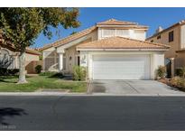 Charming two-story home with a well-maintained lawn and a two-car garage at 5452 Big Sky Ln, Las Vegas, NV 89149