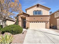 Charming two-story home with a well-manicured lawn and desert landscaping at 6236 Sereno Springs St, North Las Vegas, NV 89081