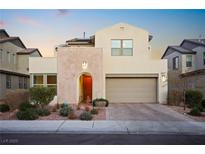 Beautiful two-story home with modern architecture, desert landscaping, and a charming arched entryway at 8290 Charleston Peak St, Las Vegas, NV 89166