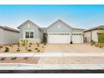Charming single-story home with a three-car garage and well-maintained landscaping at 856 Watford Pl, Henderson, NV 89011