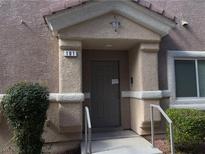 Inviting condo entrance with a covered porch and the unit number clearly displayed at 8680 Horizon Wind Ave # 101, Las Vegas, NV 89178