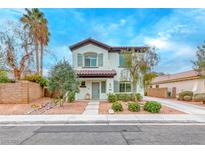 Charming two-story home with a well-manicured front yard and neutral color palette at 10639 Isola Bella St, Las Vegas, NV 89141