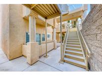Exterior view of condo building featuring stairs and covered walkways at 1817 Cutlass Dr # 0, Henderson, NV 89014