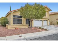Charming home featuring a two-car garage, desert landscaping, and a terracotta tile roof at 4416 Dunlap Crossing St, Las Vegas, NV 89129