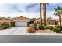 Charming single-story home with a two-car garage, desert landscaping and a private gated front entry at 5029 Alfingo St, Las Vegas, NV 89135