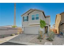 Charming two-story home featuring a spacious two-car garage and low maintenance landscaping at 5691 Tinar St, Las Vegas, NV 89113
