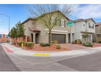 Charming two-story home featuring desert landscaping, a brown two-car garage, and a red tile roof at 6619 Frosted Harvest Ave, Las Vegas, NV 89108