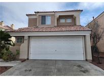 Charming two-story home featuring a neutral color palette, tile roof, and an attached two-car garage at 8005 Dover Shores Ave, Las Vegas, NV 89128