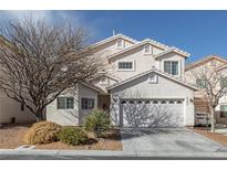 Charming two-story home featuring a two-car garage, neutral stucco, and low-maintenance landscaping at 8970 Tom Noon Ave, Las Vegas, NV 89178