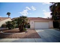 Charming single-story home with a well-maintained desert landscape and a two-car garage at 1171 Middleriver Ct, Las Vegas, NV 89123