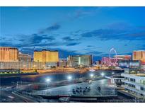 Breathtaking city view showcasing iconic hotels and the High Roller Observation Wheel at dusk at 205 E Harmon Ave # 1010, Las Vegas, NV 89169