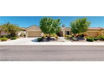 Charming single story home featuring mature landscaping and a two car garage in a quiet suburban neighborhood at 2309 Aztec Ruin Way, Henderson, NV 89044