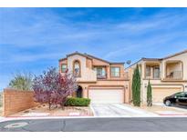 Charming home with a two-car garage, balcony, and desert landscaping at 4909 Lavaliere Ave, Las Vegas, NV 89139