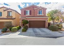 Charming two-story home featuring a well-maintained front yard with a two-car garage and inviting curb appeal at 7769 Peaceful Trellis Dr, Las Vegas, NV 89179