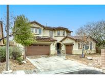 Charming two-story home with a three car garage and well maintained landscaping at 9160 Moose Country Pl, Las Vegas, NV 89178