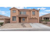 Two-story home featuring a terracotta tile roof, desert landscaping, and a two car garage at 221 Purple Passion Ave, North Las Vegas, NV 89032