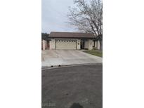 Charming single-story home with a two-car garage and well-maintained front yard at 2412 El Cid Ct, Henderson, NV 89014