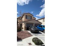 Inviting two-story home with a two-car garage and beautiful landscaping at 2431 Lilac Cove St, Las Vegas, NV 89135