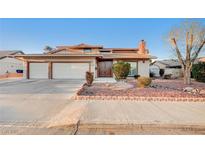 Charming single-story home featuring a well-manicured front yard and a convenient three-car garage at 2916 W Oakey Blvd, Las Vegas, NV 89102