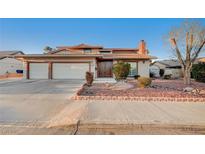 Charming single-Gathering home featuring a three-car garage and manicured landscaping at 2916 W Oakey Blvd, Las Vegas, NV 89102